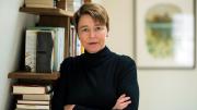 Ophelia Dahl, standing in front of a bookshelf with her arms crossed