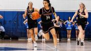 Harmoni Turner dribbles the ball up the court 