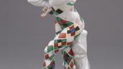 A painted porcelain figurine of Nijinsky as Harlequin in <em>Carnaval</em>