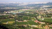 Development sprawls ever-outward from Beijing (in background, right) toward rural Sujiatuo.