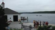 Rowers convene with coach Harry Parker. The boathouse, with its eponymous red cupola, is at left.