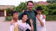 John Berlow with fellow residents of the Vietnam Friendship Village
