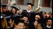 Standing on a chair, Mark D’Andrea ’97 of Winthrop House and Reston, Virginia, makes a beatific gesture. 