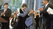 After delivering the Commencement afternoon address, retiring President Bok is hugged by president-elect Neil Rudenstine (1991).