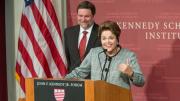 Dilma Rousseff speaks at Harvard Kennedy School. In the background is the school's dean, David Ellwood.