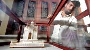 It was important to Princess Esra that the restored palace tell the story of the Asaf Jah dynasty. Here, a worker cleans a historical display.