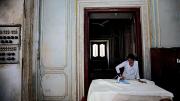 In a workshop area of the palace complex that is closed to the public, seamstresses sew and iron dozens of sets of curtains for the palaces.