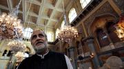 Rahul Mehrotra stands in the <i>darbar,</i> the ceremonial hall where coronations took place.