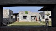 The dwellings are arranged in groups of four, oriented around a central courtyard.