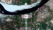 A satellite view shows the main monument at the center, with the gardens in front (bottom) and the Yamuna River behind (top). Few visitors realize that there is another garden across the river. The Mehtab Bagh, or Moonlight Garden, contained an octagonal pool that reflected an image of the monument; historians believe the garden, now mostly in ruins, was designed as a viewing place for the monument.