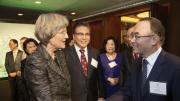 Harvard President Drew Faust shakes hands with Jaewan Bahk, M.P.P. ’88, Ph.D. ’92, as Jin Park, M.P.A. ’85 (next to Faust), looks on during the Harvard Alumni Association dinner in Seoul.