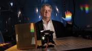 Instrument designer Andrew Szentgyorgyi illustrates the prism technology for the GMT’s high-resolution spectrograph.