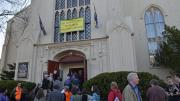 Attendees line up outside the First Parish in Cambridge for Sunday's launch event.