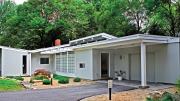 A house in the Five Fields neighborhood nestles against trees.