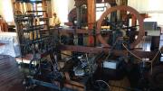 View of early mill machinery constructed of wood and metal 