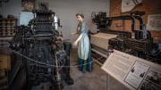 Statue of a woman working in a textile mill  