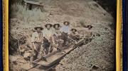 Gold miners working with a piece of gold-mining equipment called a long tom, circa 1850