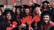 Harvard students in caps and gowns enjoying Commencement 