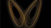 A stylized plot of Lorenz's "butterfly effect" model against a black background with gold-toned curves wrapping themselves around unshown x and y axes, resembling the wings of a butterfly