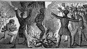 Illustration of the murder of Francis McIntosh in 1836. McIntosh is bound to a tree and burned alive while a mob watches.