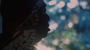 A still image from the film, This is Love, showing Rudy Love in shadowed profile