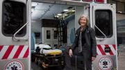 Pediatrician Eileen Costello stands next to the Boston Medical Center’s mobile pediatric clinic.