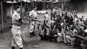 British soldiers and local police searching homes to interrogate subjects during Mau May rebellion, c. 1954