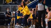 Carrie Moore on the sideline of a basketball game.
