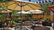 sunny patio with umbrellas over tables
