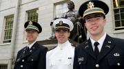 Newly commissioned officers: Second lieutenants Scherer and Higgins flank Midshipman Reach.
