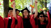 Having just received their degrees, newly minted Harvard Ph.D.s, in their distinctive doctoral gowns, celebrate the culmination of years of study.