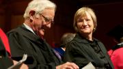 President emeritus Derek Bok—finally invited to speak at this, his twenty-second PBK ceremony—checks the text of his oration; President Drew Faust is seated beside her predecessor. 