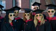 Ready for anything, Harvard Business School M.B.A.s-to-be fend off the sun in their matching "HBS Section J 2012" shades.