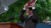 Andy Samberg holds up "the collected works of William Yates."