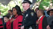 Boston police officer Stephen McNulty led the singing of the National Anthem.