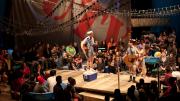 The pirates make their entrance.  Robert McLean, atop the cooler, is the Pirate King.