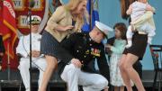 Second Lieutenant Taylor Evans, already a veteran of five years in the Marine Corps before entering Harvard, has his officer's insignia pinned on by his family.