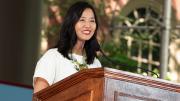 Michelle Wu behind a lectern