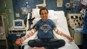 All in a day’s treatment: Khaled, seen in these photographs with hemapheresis practitioner Beverly Gedutis, R.N., and author David Nathan, spent May 8 at Children’s Hospital Boston, where for decades he has been transfused with red blood cells every three weeks. The bottles he carries below contain the iron chelator deferisirox.