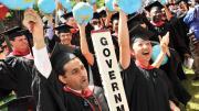 Kennedy School class marshals Asif Chishti, of Lahore, Pakistan, and Katherine Chon, of Salem, New Hampshire, both M.P.A. ’10, lead a cheer.