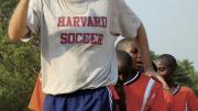 Nick Gates ’91, who founded Coaches Across Continents, works with coaches (above) and youths (at right) in Tanzania in 2009. 