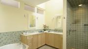 Another use of transom windows to bring light to a bathroom lacking exterior windows