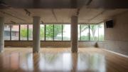 Windows let in light and rural views during yoga classes