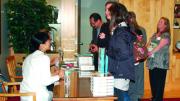 Signing books for Friends of Harvard Magazine
