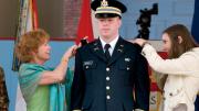 New second lieutenant Christopher Higgins ’11 has his bars pinned on by his mother and sister.