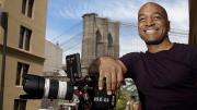 Film director Mustapha Khan near his home and studio, in the shadow of the Brooklyn Bridge 