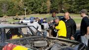 Khan shooting a stock car