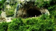 Views from inside and outside Dzudzuana Cave in the Republic of Georgia. Bar-Yosef and colleagues are working to date the Middle to Upper Paleolithic transition here in the Caucasus foothills, where it may have occurred much later than in other parts of Europe. 