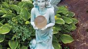 A statue of Titania holds a solar-powered orb.