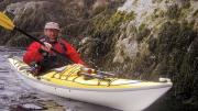 John Huth navigating through a rock slot of Placentia Island in coastal Maine 